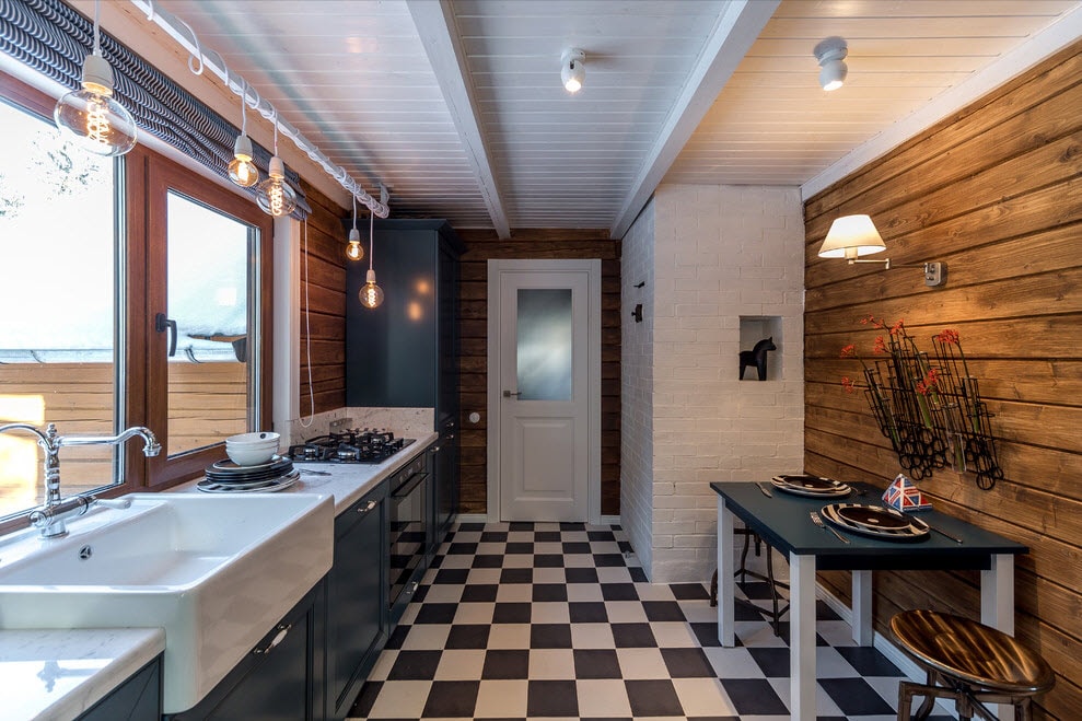 Placing kitchen appliances and sinks in a row in the kitchen of a country house