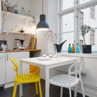 Yellow chair in a white kitchen