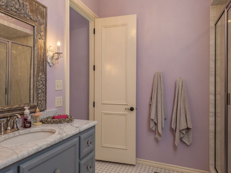 Light-colored plastic door in the interior of the bathroom