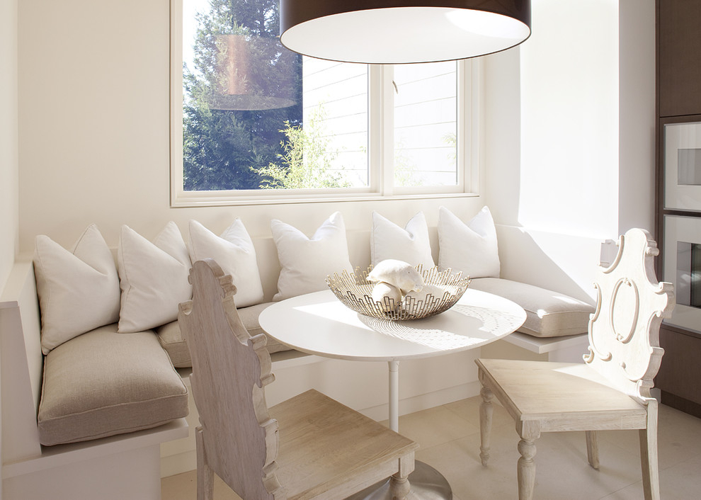 White pillows on a sofa in a dining area