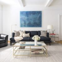 White beams on the ceiling of a bright living room