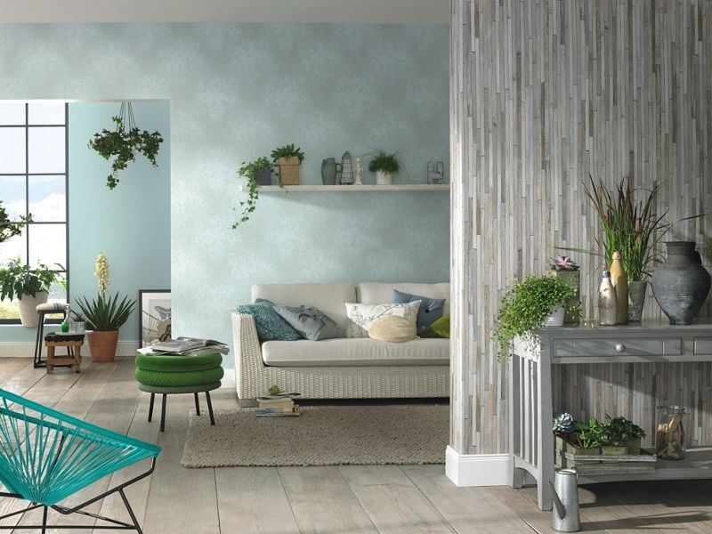 Living plants in the living room interior with paper wallpaper