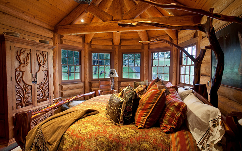 The interior of the bedroom in a log house in the Russian style