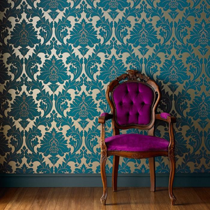 wooden chair against a wall with dark gold wallpaper