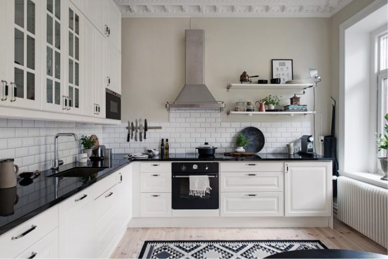 Corner layout of a kitchen-living room in a city apartment