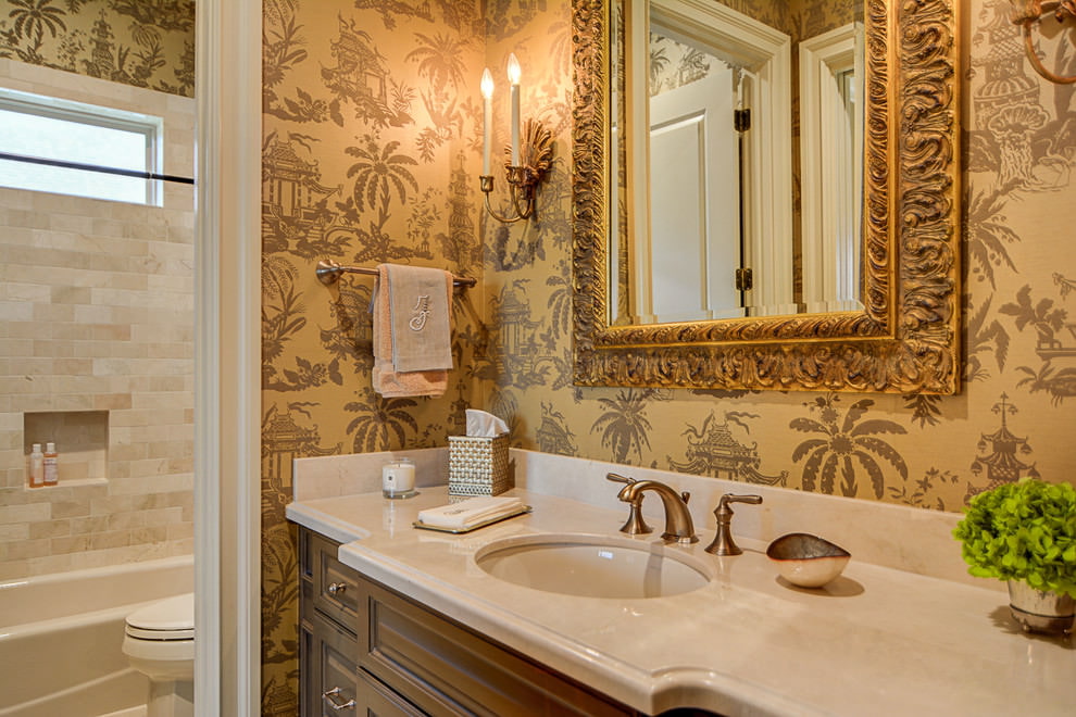 White sink and mirror in a gold frame