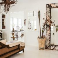 Wooden vase by the mirror in the living room