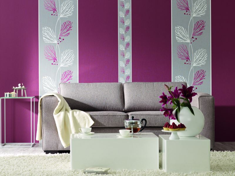 Highlighting a living room sofa with strips of vibrant wallpaper