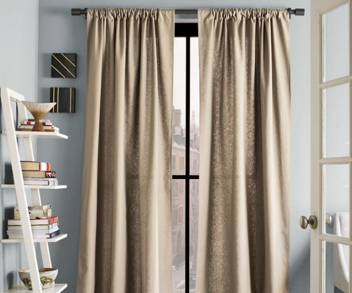 Burlap curtains on a window of a country house