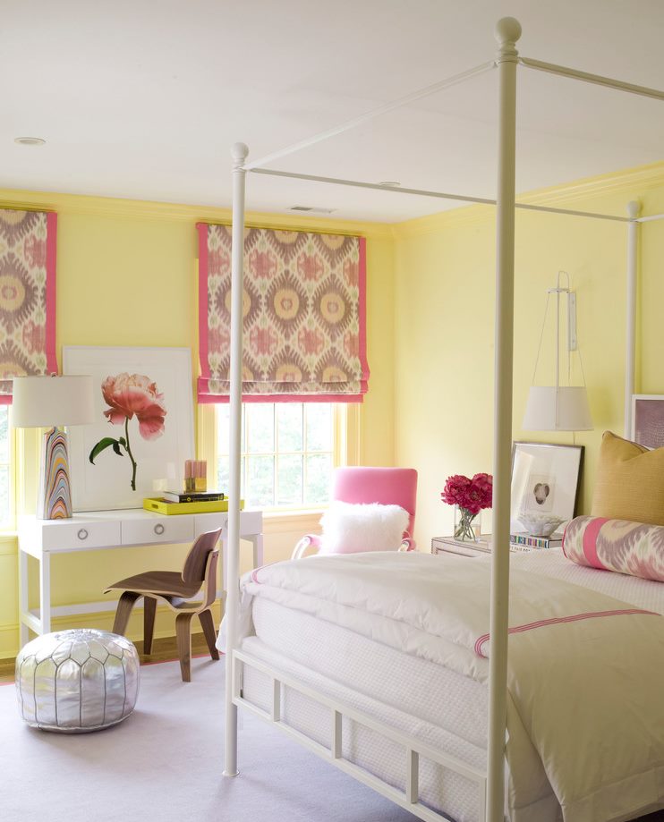 Roman curtains with pink trim in the bedroom of the girl