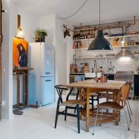 Folding dining table in the interior of a small apartment