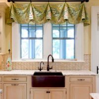 Kitchen sink in front of a window in a private house