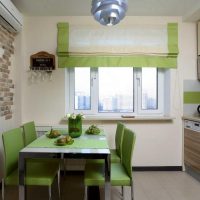 Green dining area in a small kitchen