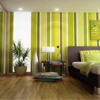 Vertical stripes on the wallpaper in the bedroom