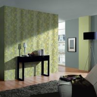 Green wallpaper in the living room with a gray ceiling