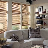 Gray corner sofa in the living room of a country house