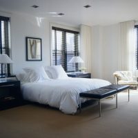 White bedding on the bed of the young couple