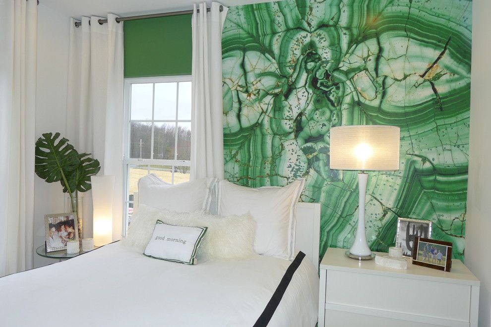 White bed in the bedroom of a private house