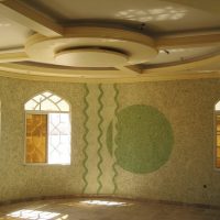 Multi-level plasterboard ceiling in the living room interior