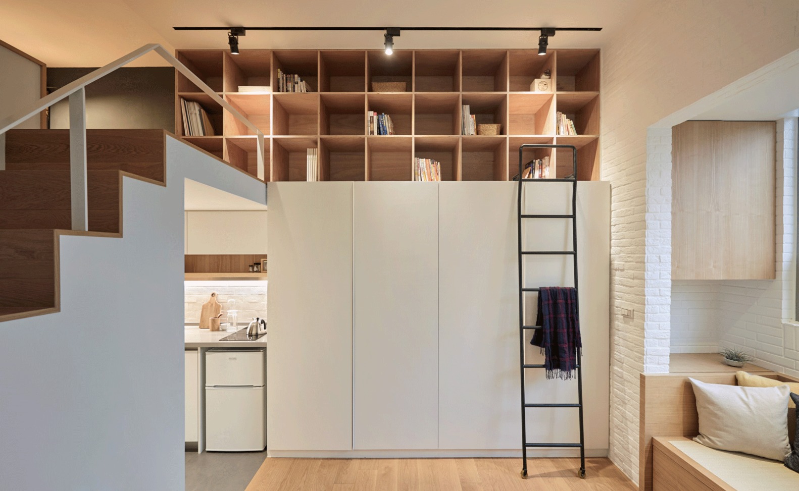 Open bookcase on the mezzanine in the common room.