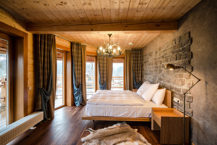 Wooden bed with white linens