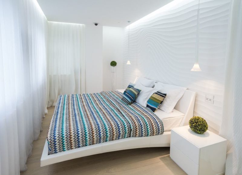 Narrow bedroom interior in white