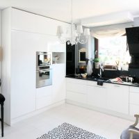 A sink in front of a kitchen window in a private house