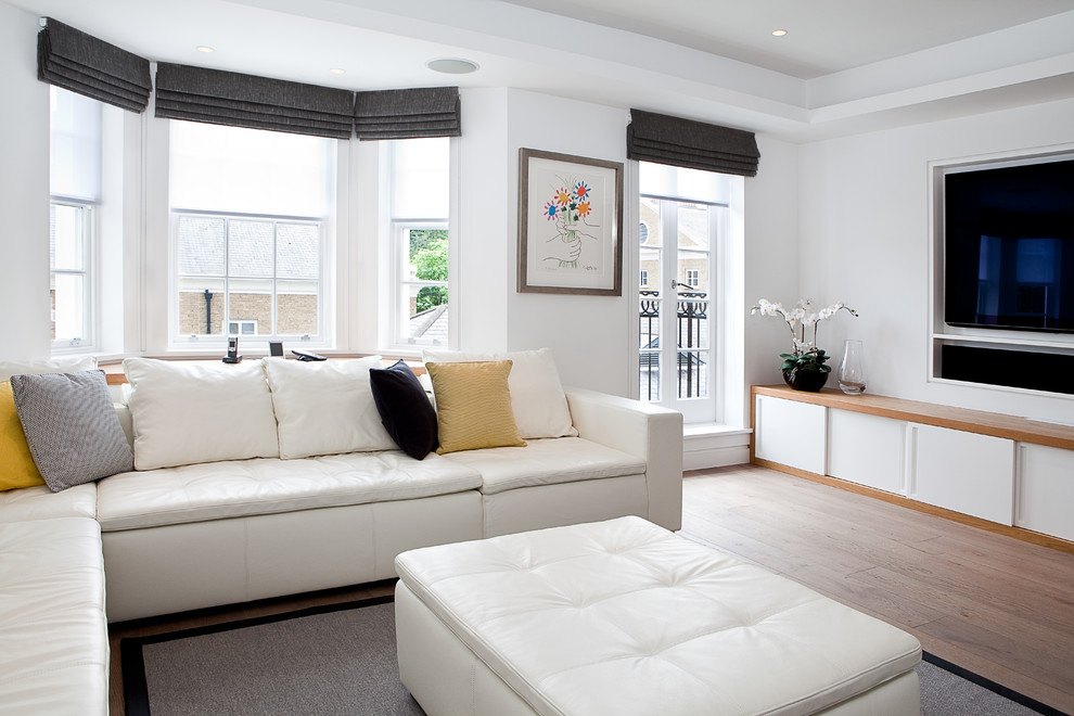 White living room interior with black roman curtains