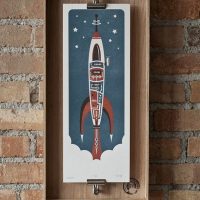 Drawing a rocket on a brick wall