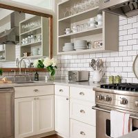 Mirror above the kitchen sink and open shelves