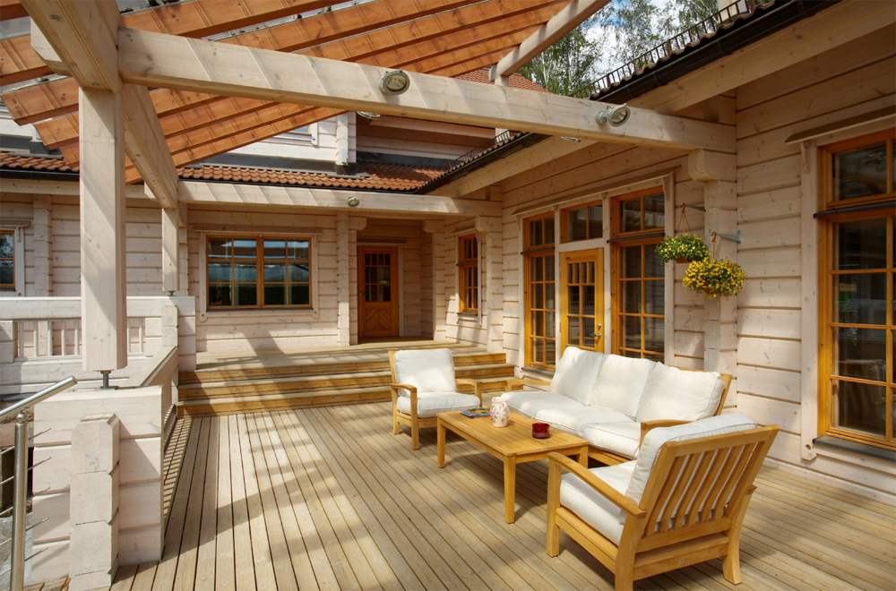 Open terrace in front of the house from glued beams