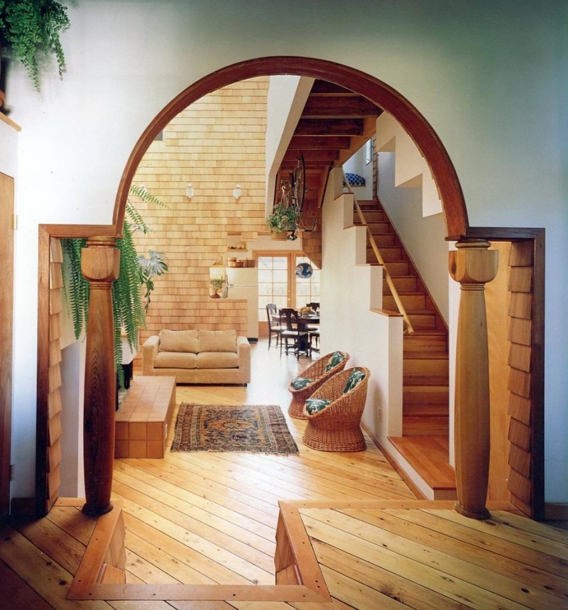 Natural wood columns in the lobby of a private house