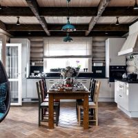 Corner kitchen with dining table.