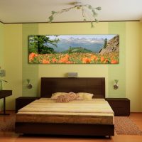 Painting with natural scenery over the head of the bed