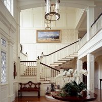 Two-flight staircase in the hallway of a country villa