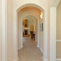 Narrow long corridor with white walls