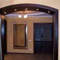 Spotlights in a wooden arch