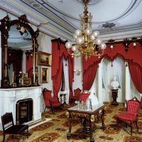 Burgundy curtains on the windows of the living room