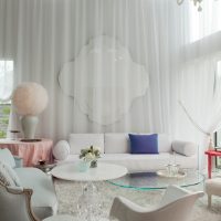 White tulle on the living room wall with high ceiling