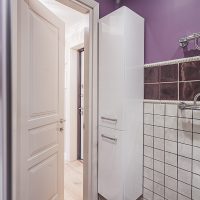 Narrow cupboard in the corner of the bathroom