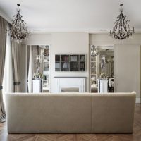 Two black wire chandeliers on the living room ceiling