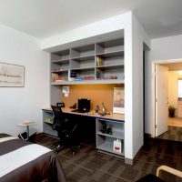 Built-in shelves above the desk