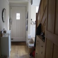 Boxes under the stairs in the hallway of a country house