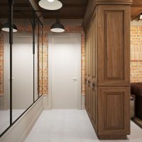 A wooden cabinet instead of a partition between the hallway and the living room