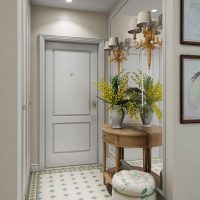 Vase with fresh flowers on a pedestal in the hallway