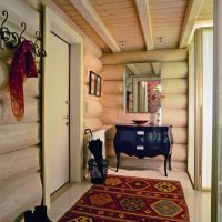 Narrow entrance hall in a log house