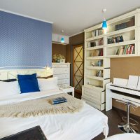 Blue wallpaper in the bedroom interior