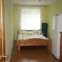 Wooden bed in the bedroom of a rural house