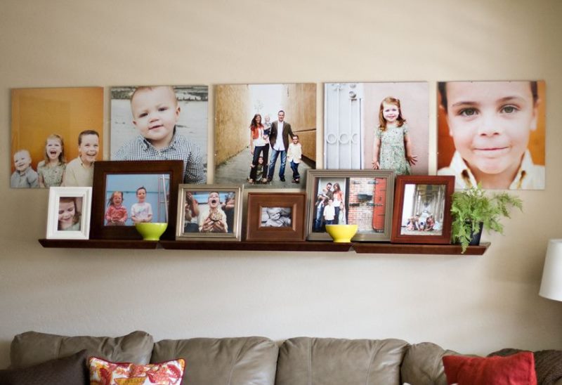 Shelf with family photos on the living room wall