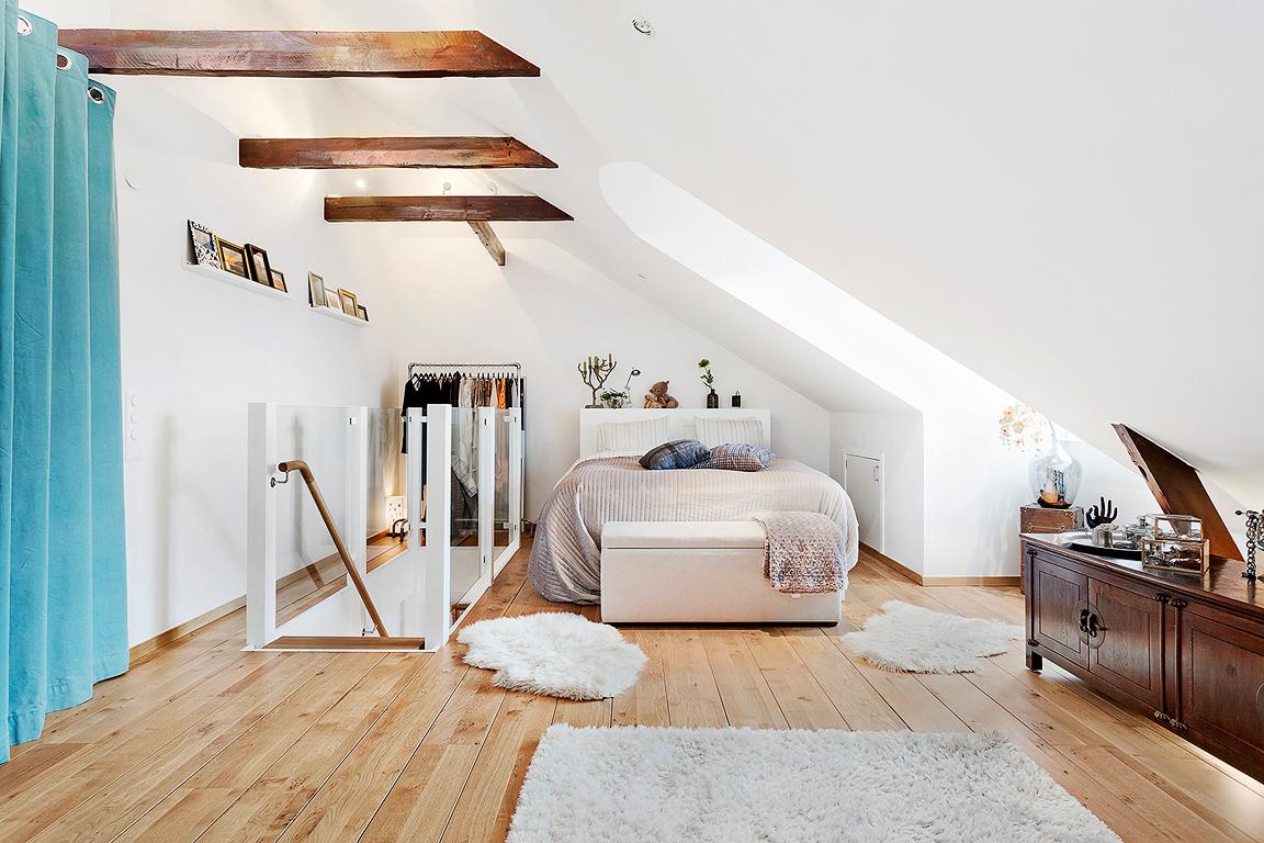 White sloping ceiling in the attic room